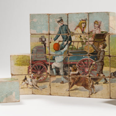 A photograph of a 19th century children's block puzzle